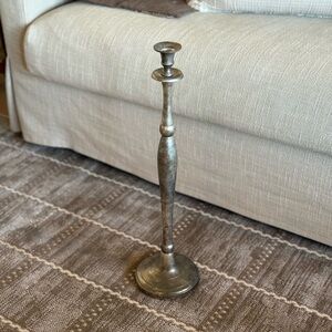 Tall silver candlestick holder